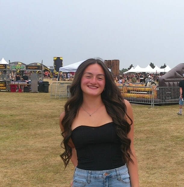 Image of smiling woman with long brown hair
